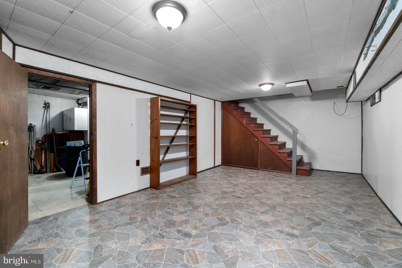 41 Tanglewood Road Baltimore, MD 21228 - Photo 33 of 35 NEW vinyl flooring & bead board in basement area