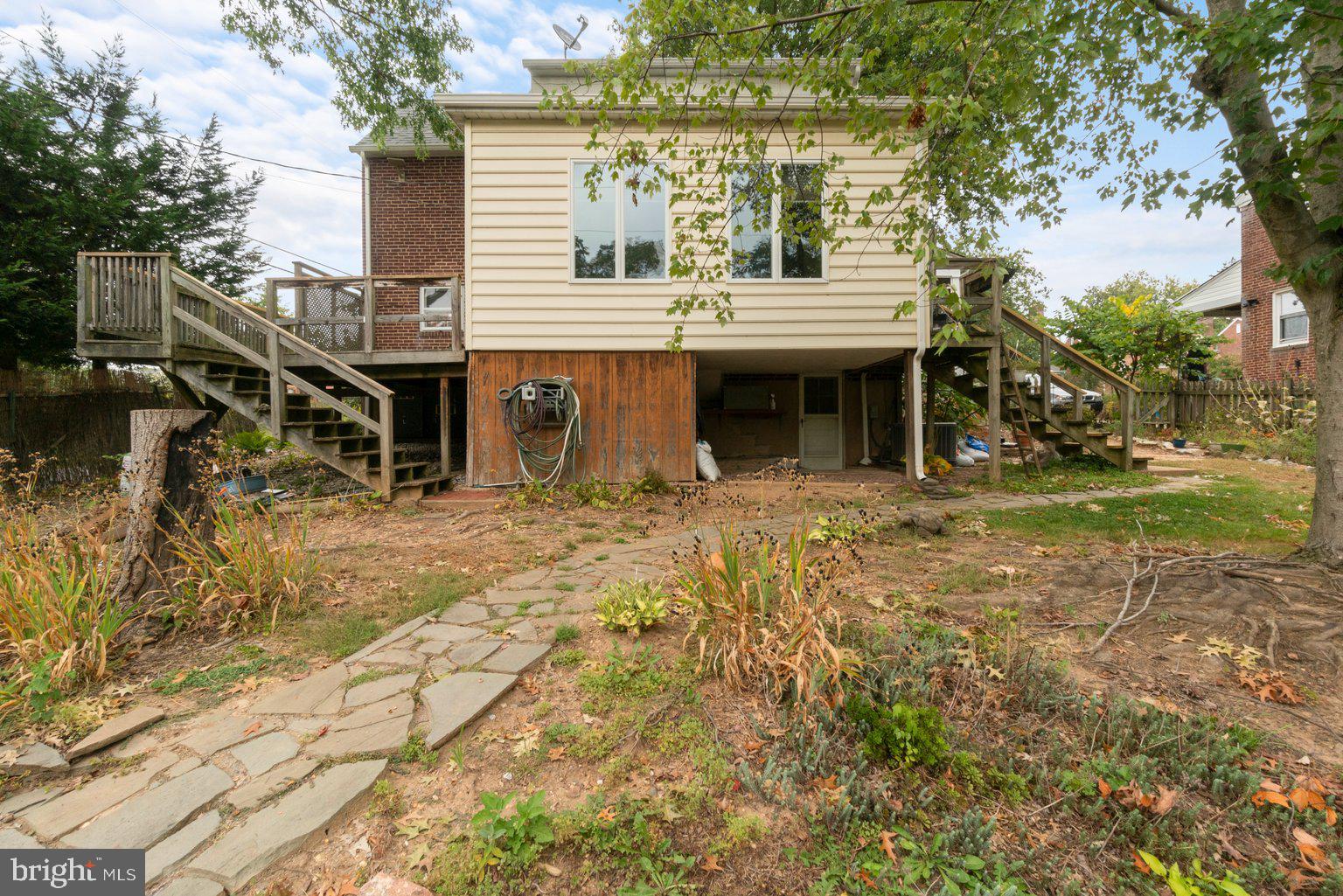 41 Tanglewood Road Baltimore, MD 21228 - Photo 6 of 35 Stone pavers lead to various garden spots
