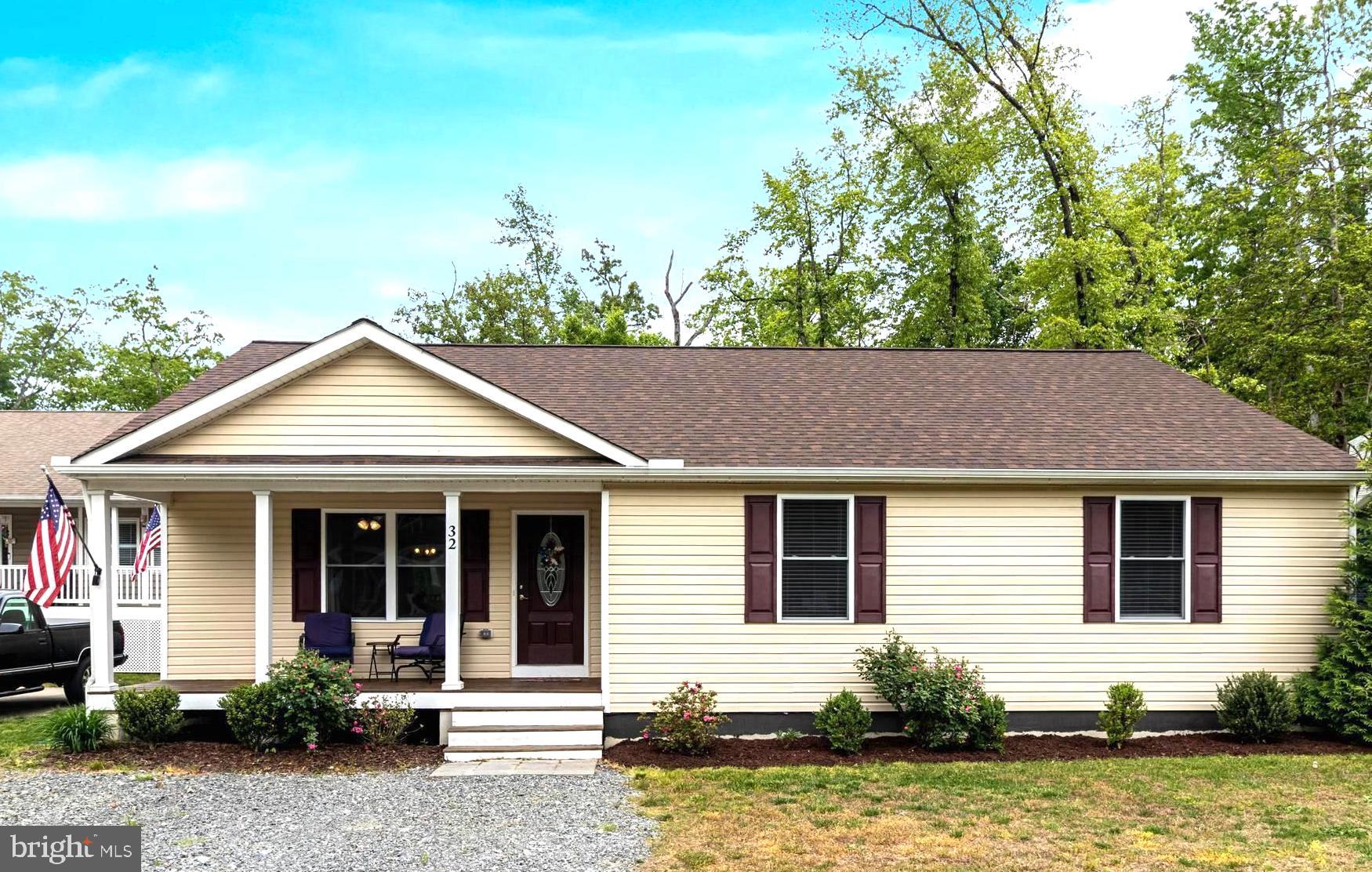 32 Placid Road Colonial Beach, VA 22443 - Photo 7 of 54 front view of house with potted plants
