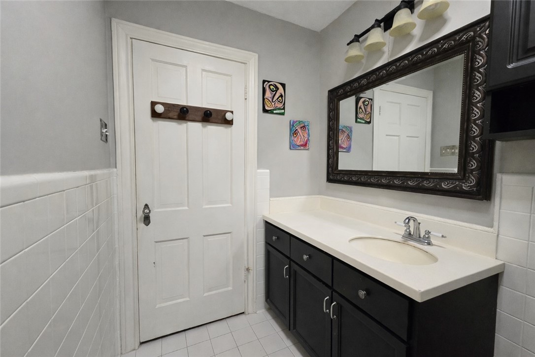 332 Southern Street Corpus Christi, TX 78404 - Photo 11 of 20 a bathroom with a sink vanity and a mirror