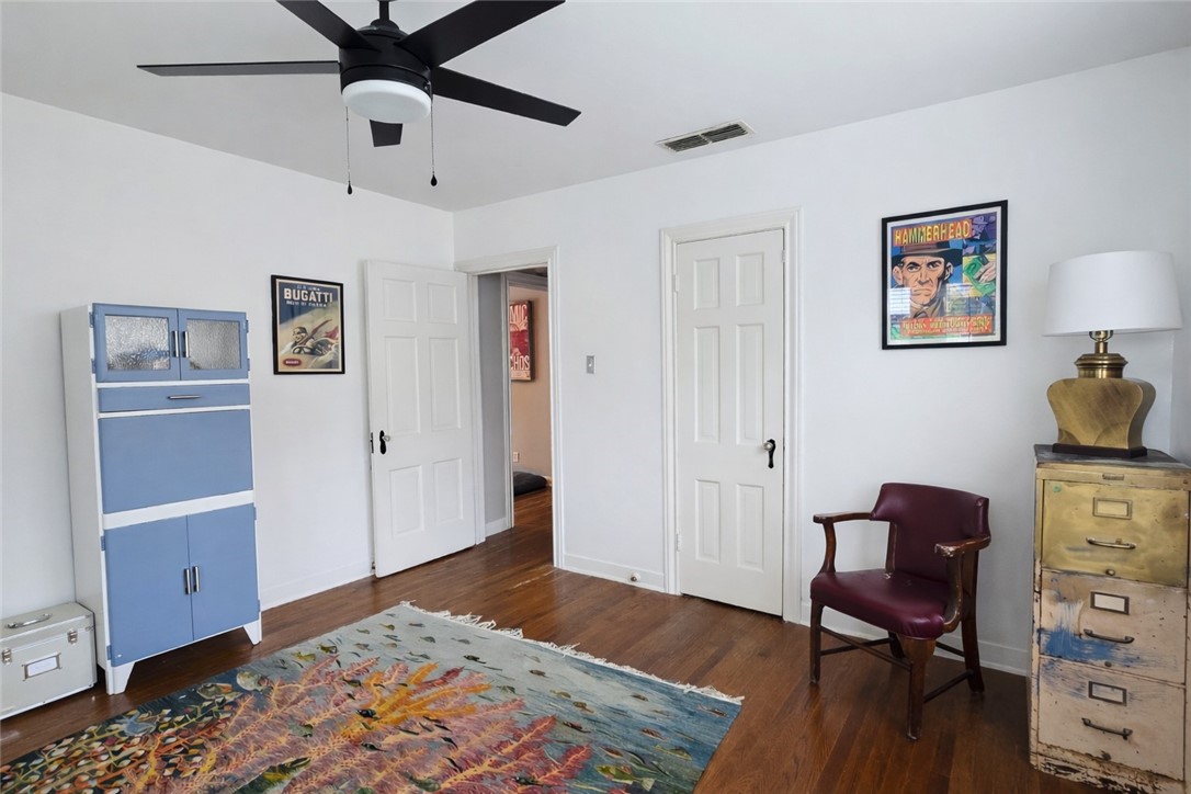 332 Southern Street Corpus Christi, TX 78404 - Photo 14 of 20 a bedroom with a bed and wooden floor