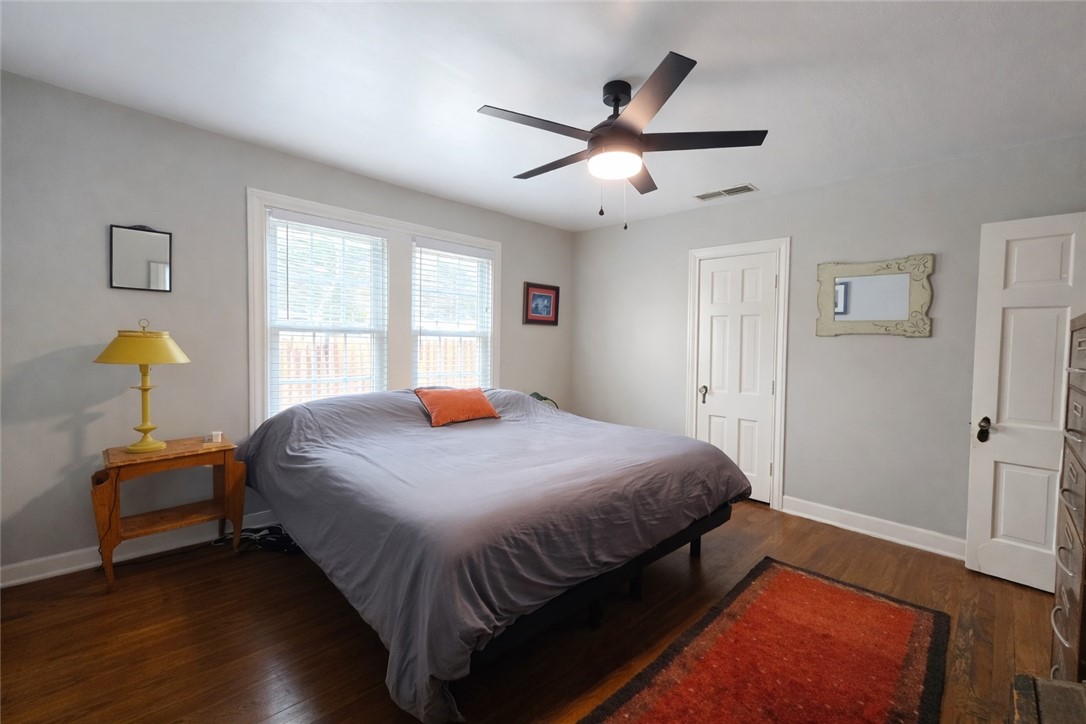 332 Southern Street Corpus Christi, TX 78404 - Photo 9 of 20 a bedroom with a bed and wooden floor