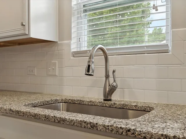 a bathroom with a bathtub and window