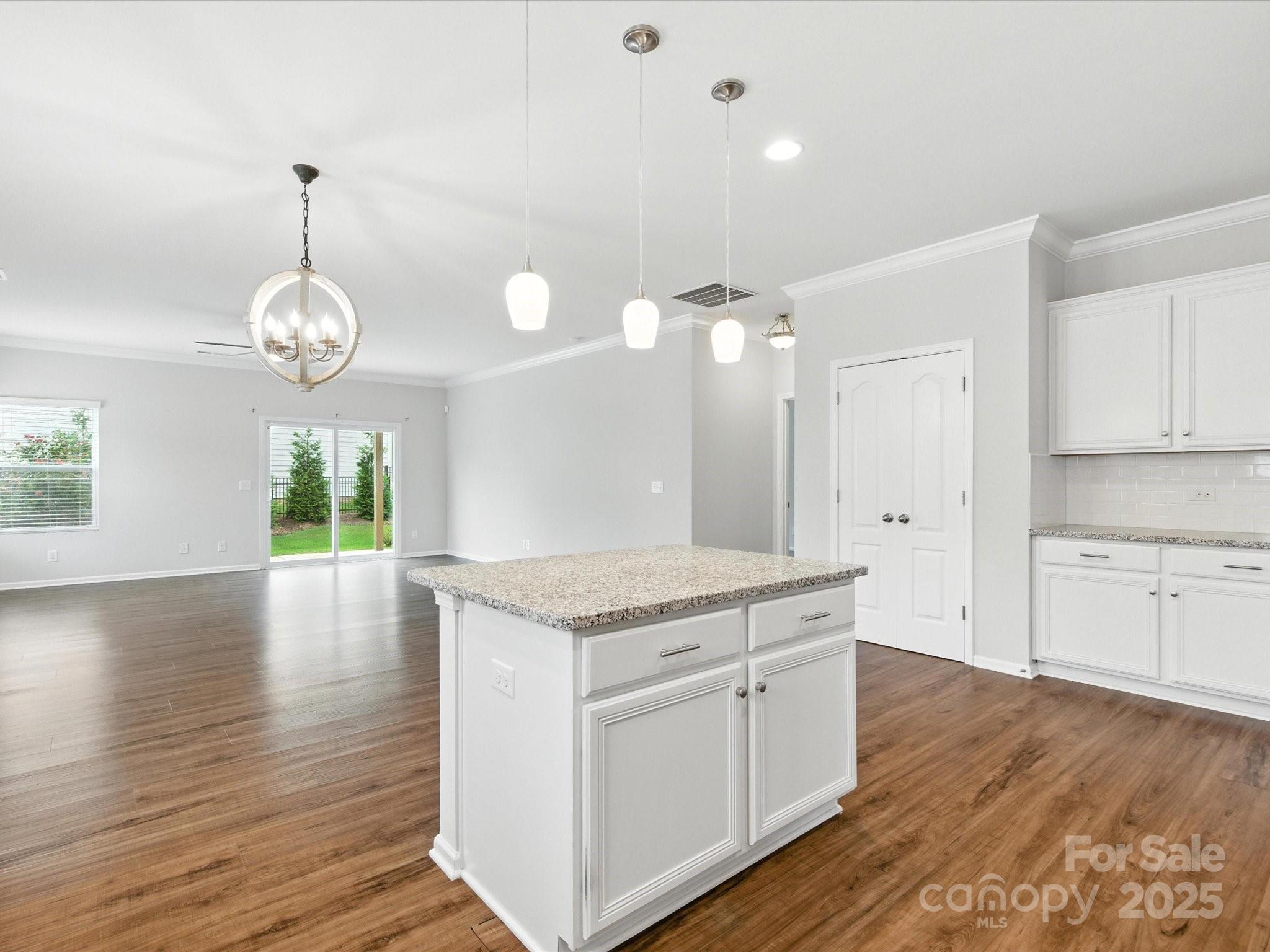 1628 Spring Blossom Trail Fort Mill, SC 29708 - Photo 14 of 42 a kitchen with a wooden floor and window