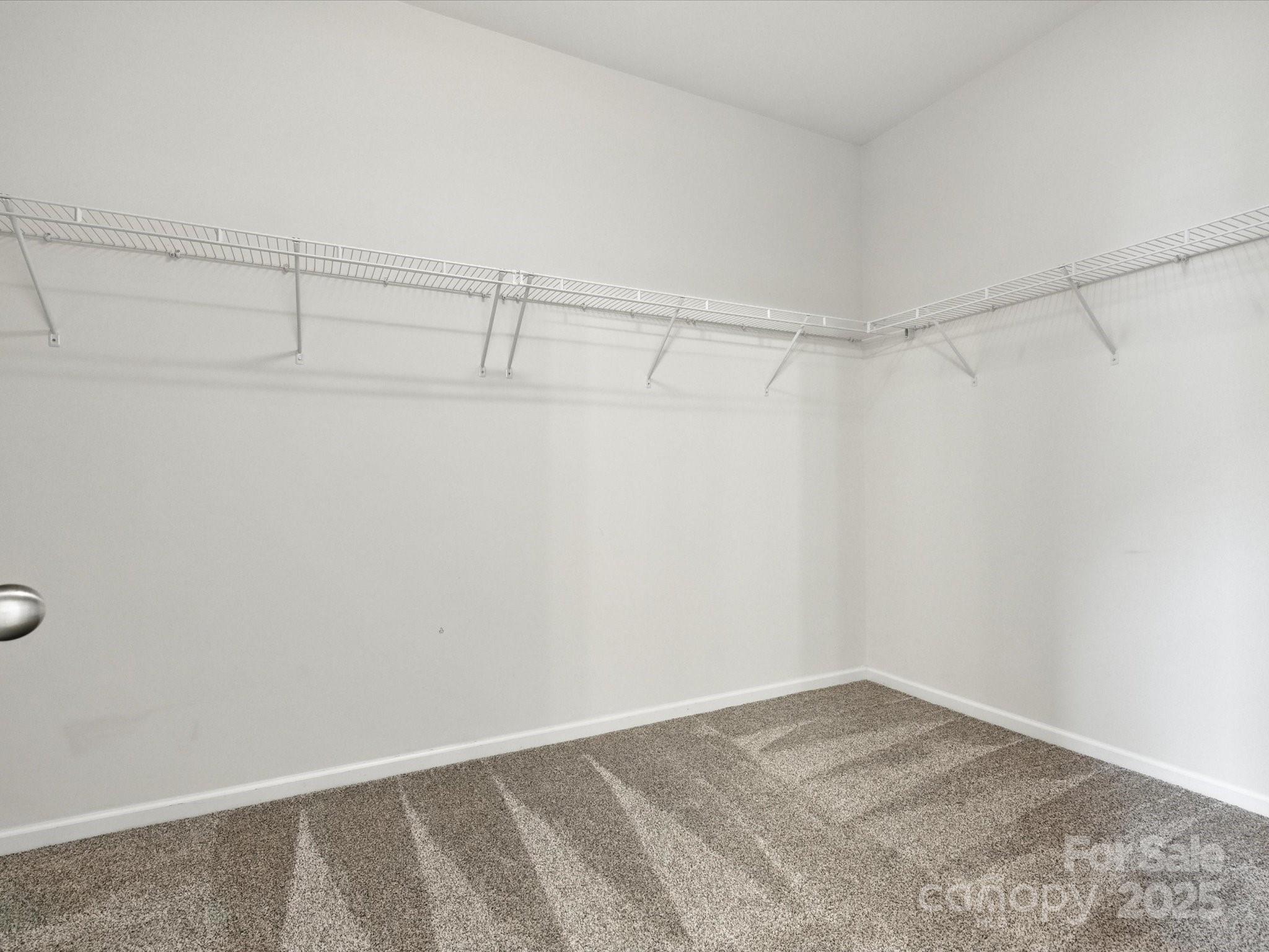 1628 Spring Blossom Trail Fort Mill, SC 29708 - Photo 26 of 42 a view of a room with racks on the wall