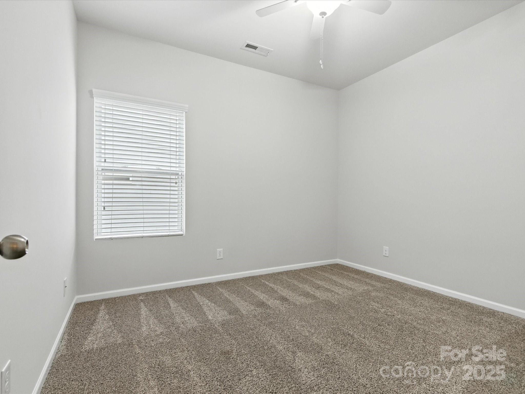 1628 Spring Blossom Trail Fort Mill, SC 29708 - Photo 29 of 42 an empty room with a window