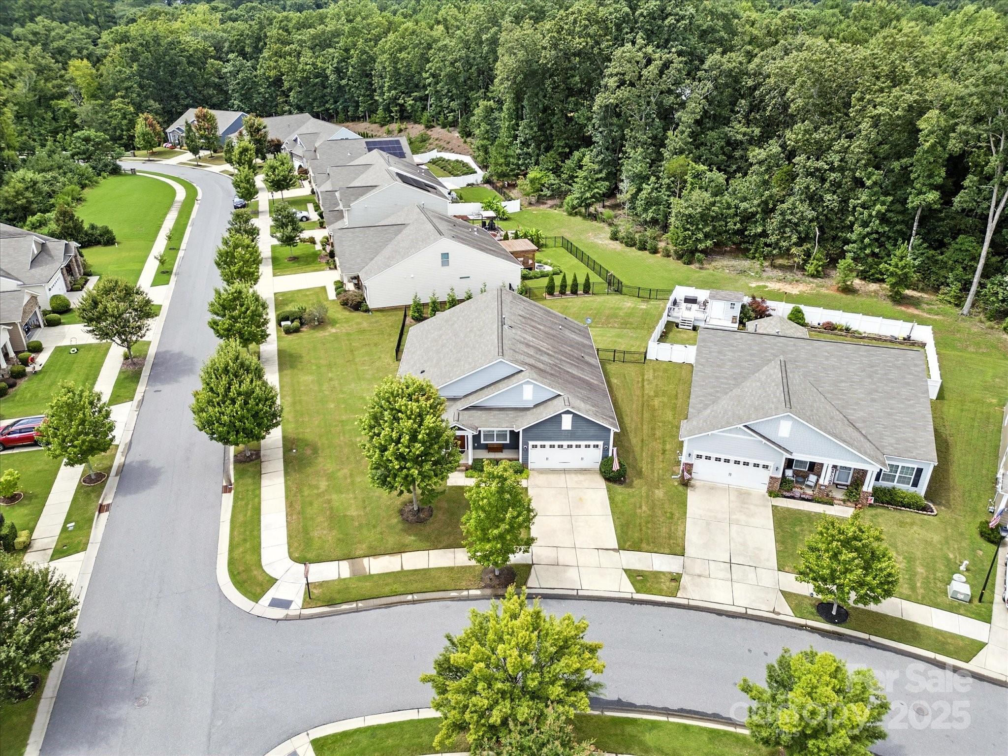 1628 Spring Blossom Trail Fort Mill, SC 29708 - Photo 36 of 42 an aerial view of a house with a garden