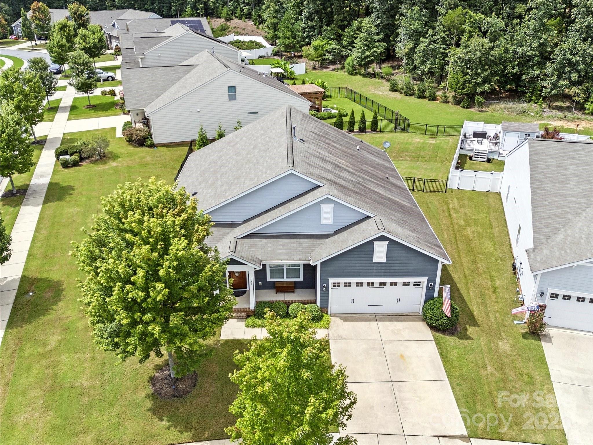 1628 Spring Blossom Trail Fort Mill, SC 29708 - Photo 38 of 42 a view of a house with a yard