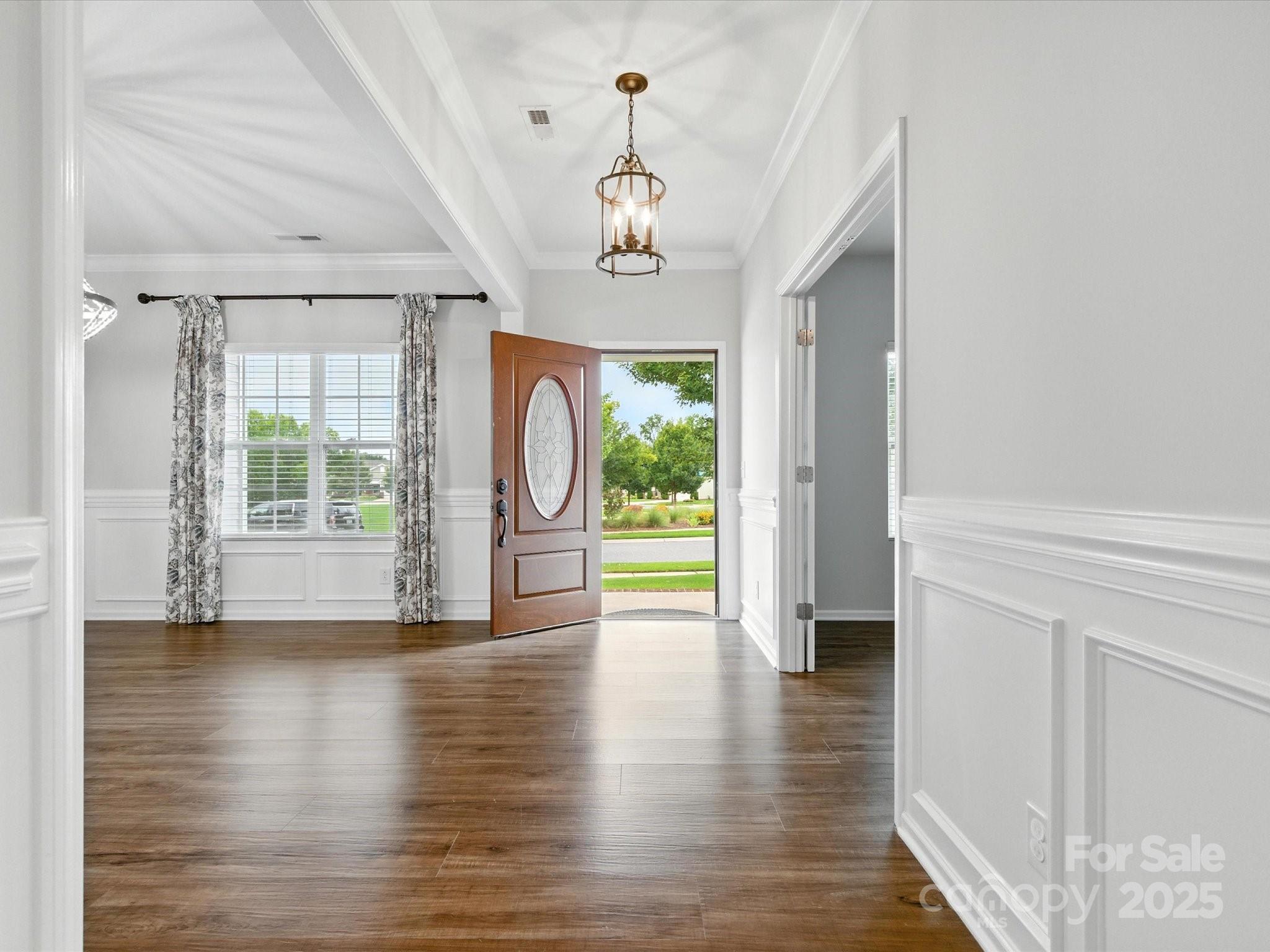 1628 Spring Blossom Trail Fort Mill, SC 29708 - Photo 4 of 42 a view of a room with wooden floor fireplace and windows