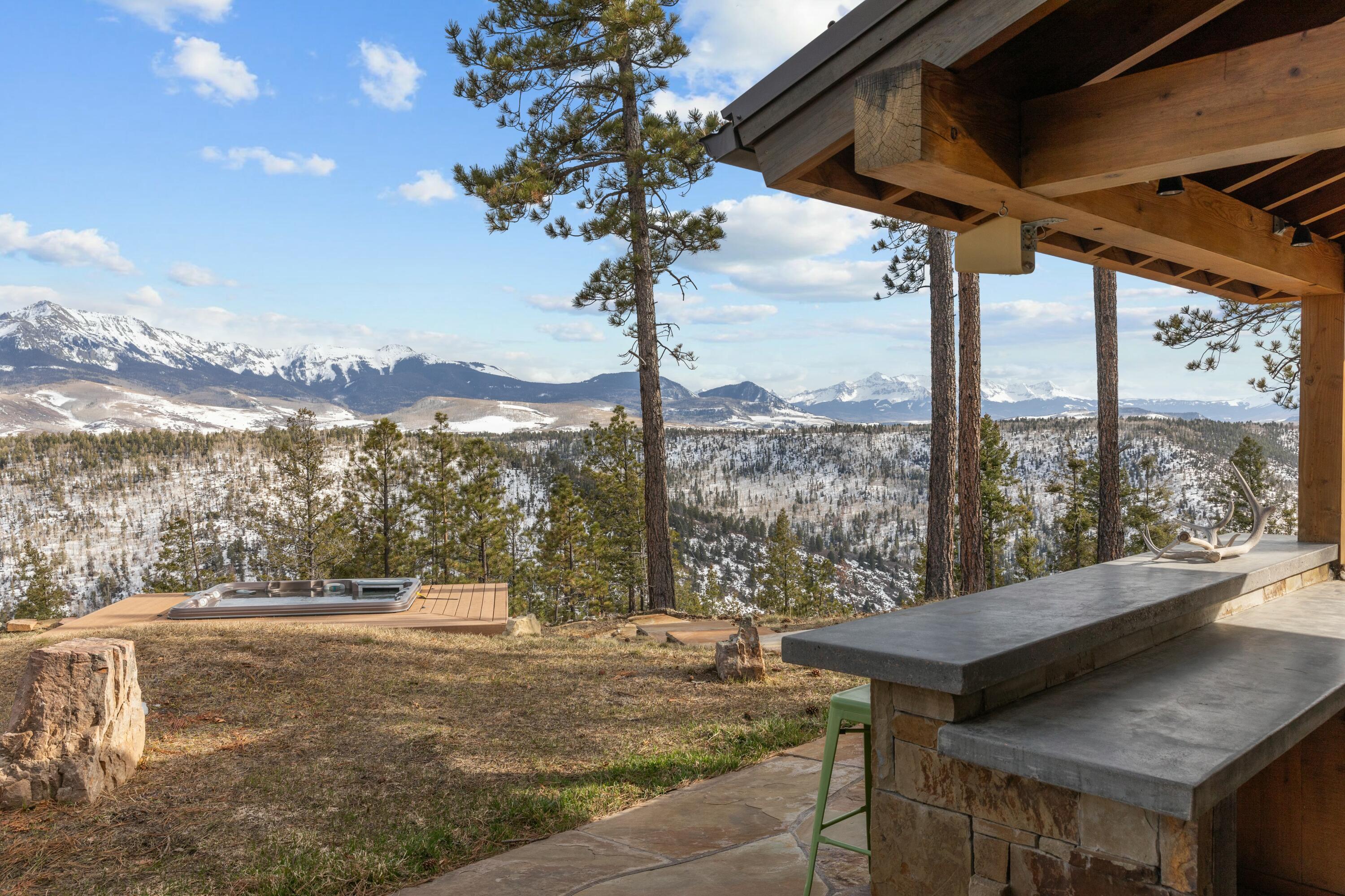 280 Sage Grouse Ridgway, CO 81432 - Photo 14 of 28 a view of a porch with a table and chairs
