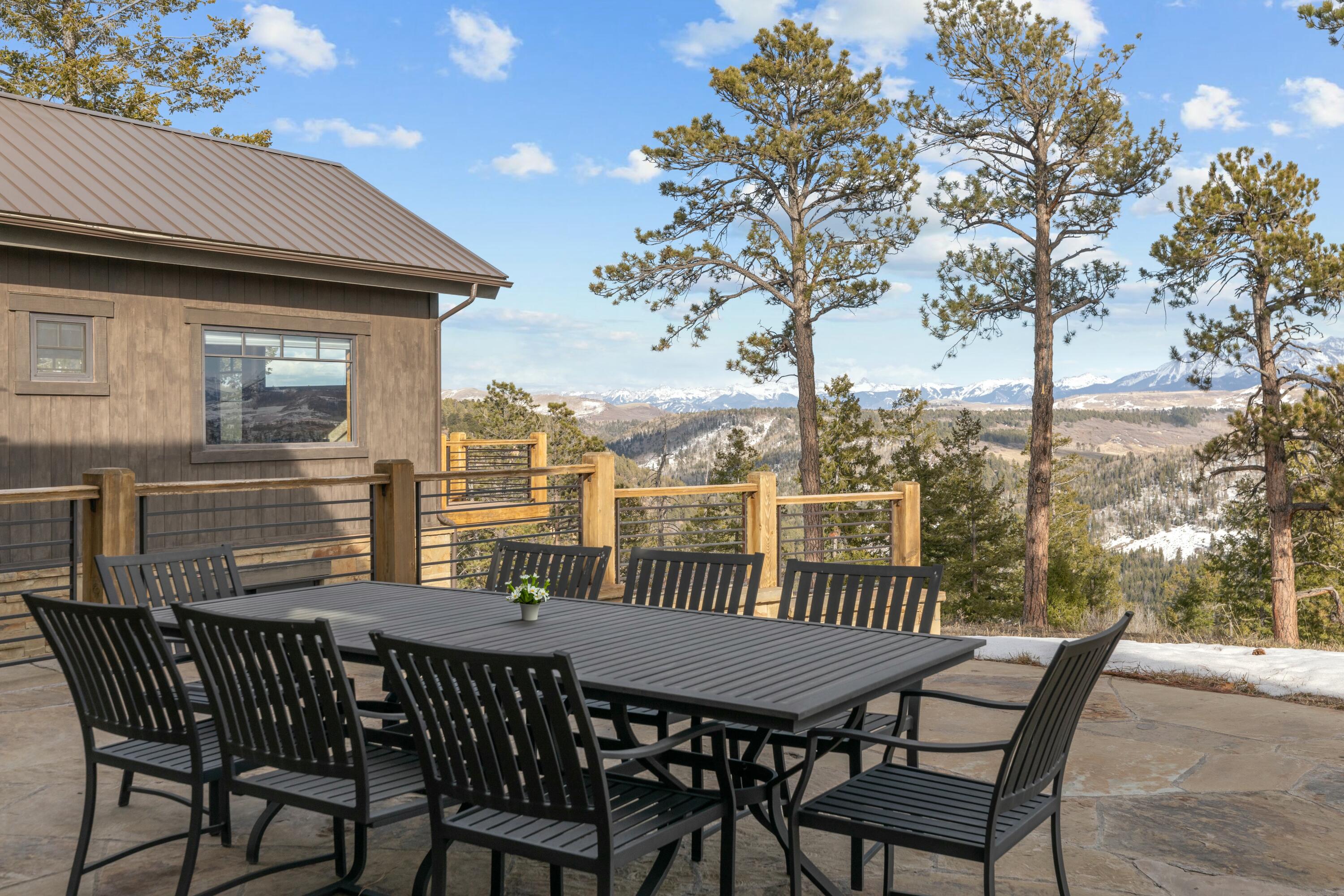 280 Sage Grouse Ridgway, CO 81432 - Photo 17 of 28 a view of a deck with a table and chairs with wooden floor and fence