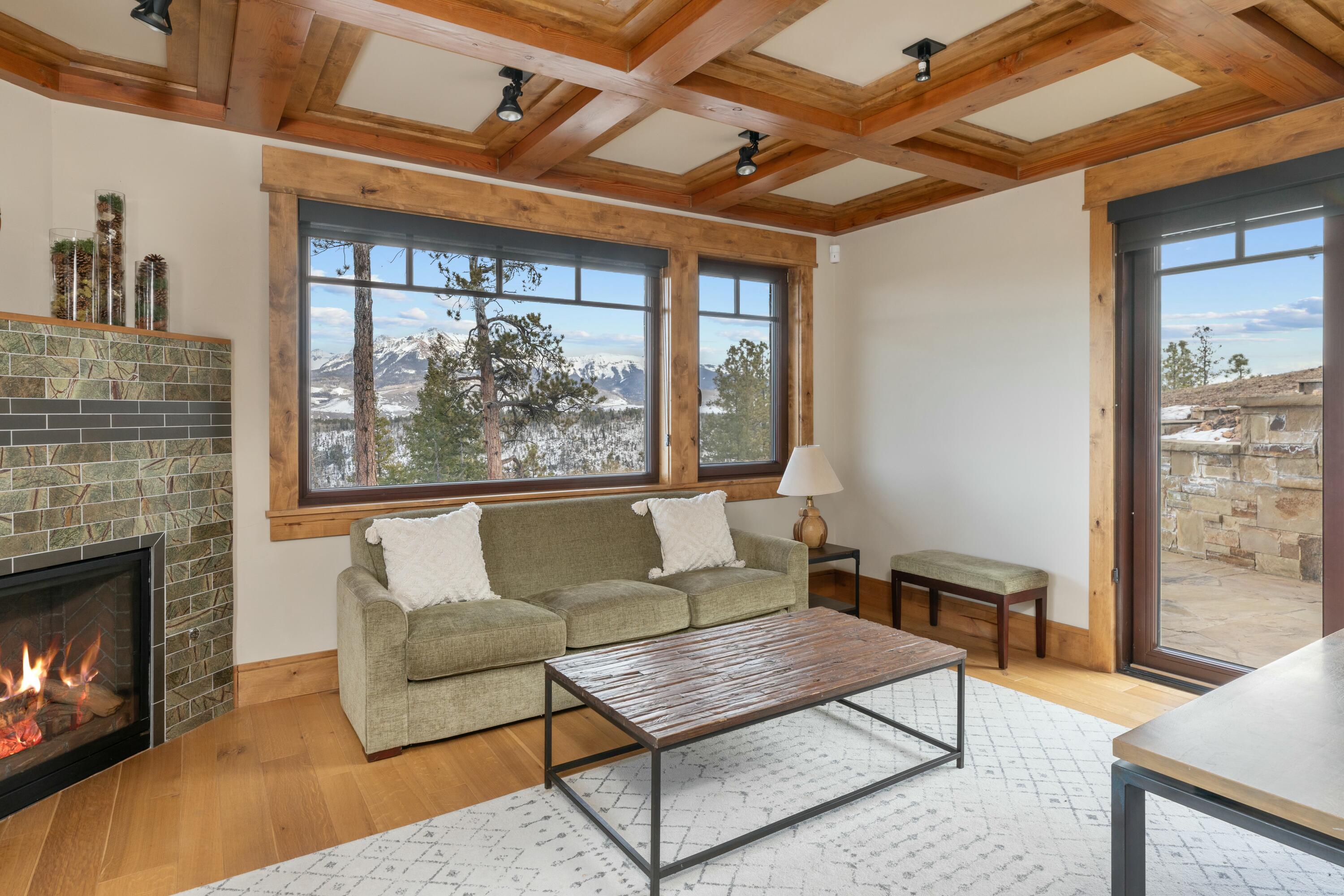 280 Sage Grouse Ridgway, CO 81432 - Photo 19 of 28 a living room with furniture a large window and a fireplace