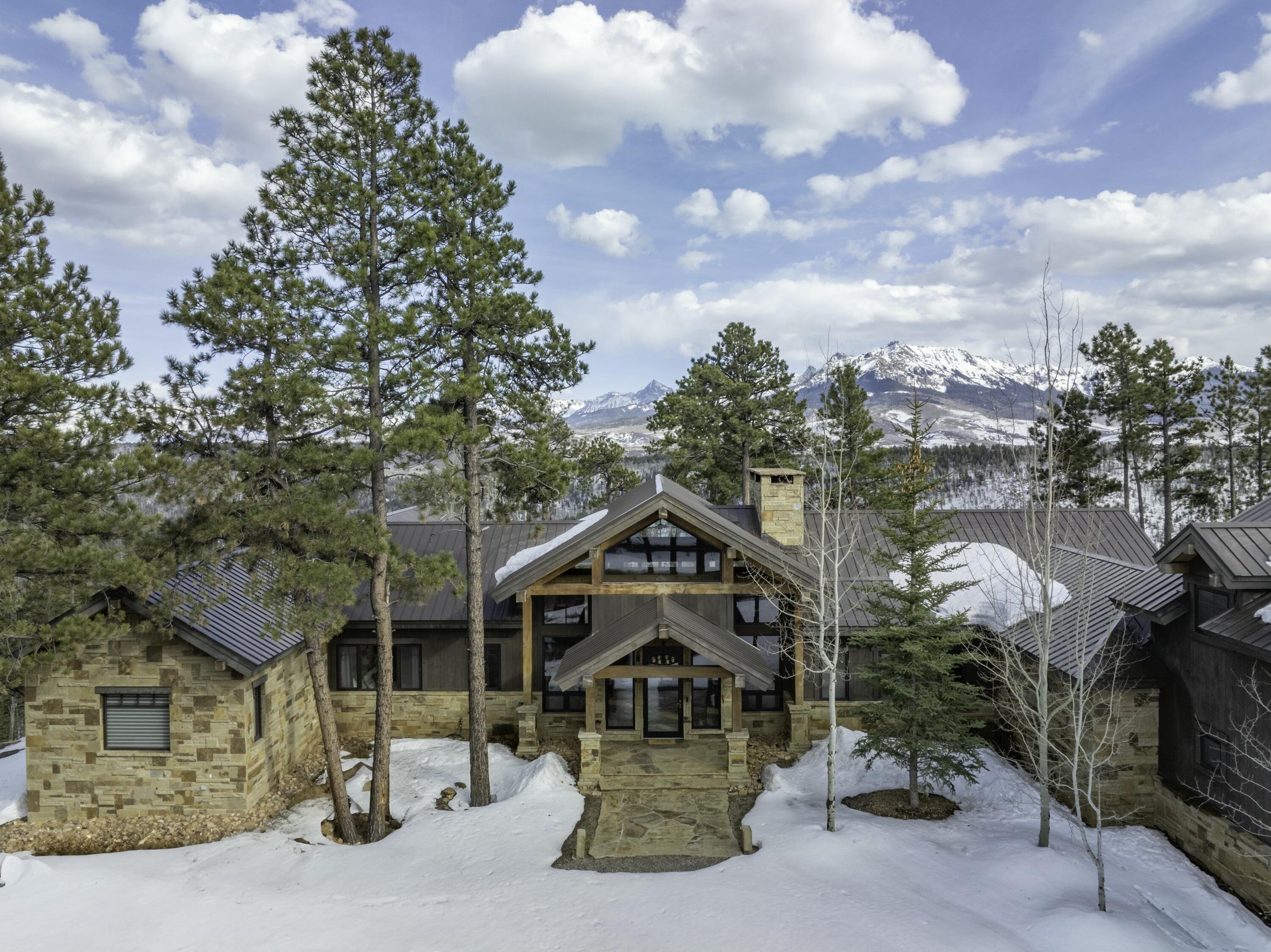 280 Sage Grouse Ridgway, CO 81432 - Photo 2 of 28 a house with green field in front of it