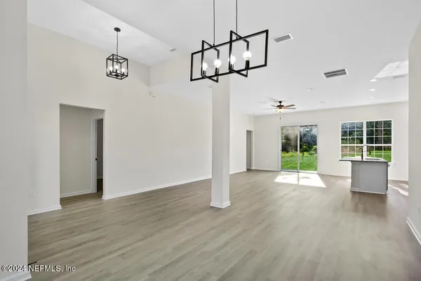 a view of kitchen with furniture and wooden floor