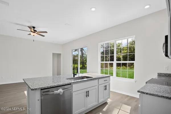 a kitchen with a stove and a microwave