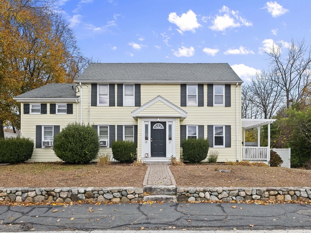 27 Kilby Street, Unit 27 Woburn, MA 01801 - Photo 1 of 35 a front view of a house with garden