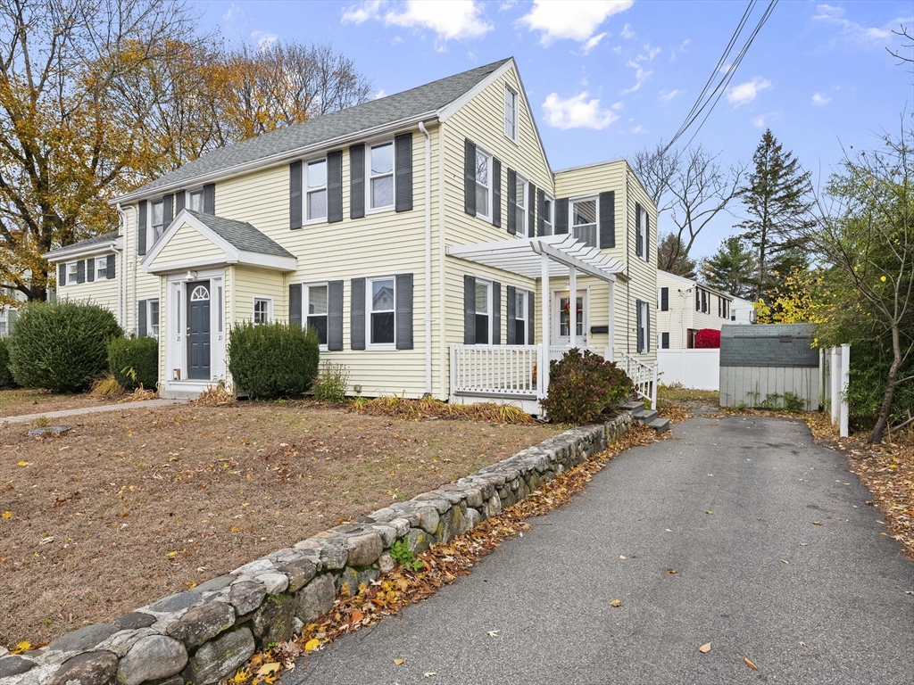 27 Kilby Street, Unit 27 Woburn, MA 01801 - Photo 2 of 35 a front view of a house with a garden