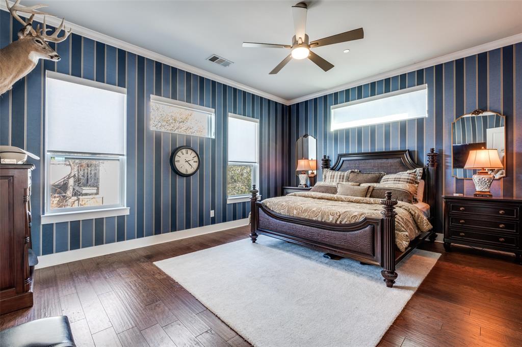 1262 North Prairie Avenue Dallas, TX 75204 - Photo 15 of 24 a spacious bedroom with a large bed and a window