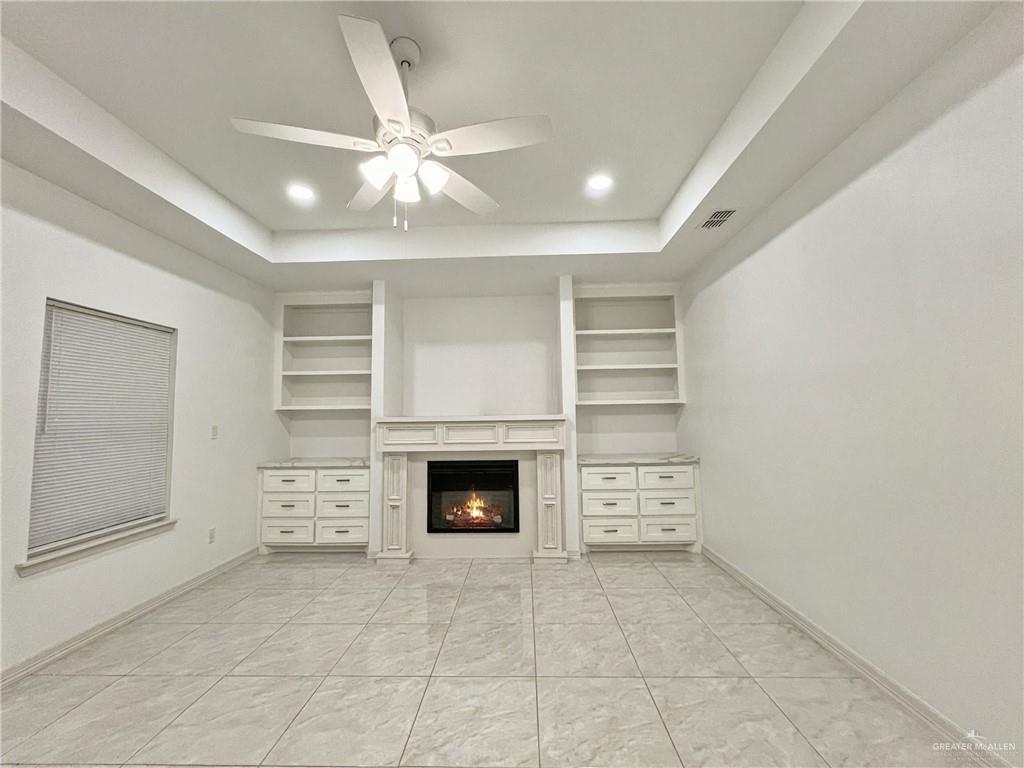7723 Villa Rama S Street Mission, TX 78572 - Photo 2 of 15 an empty room with cabinets and fireplace