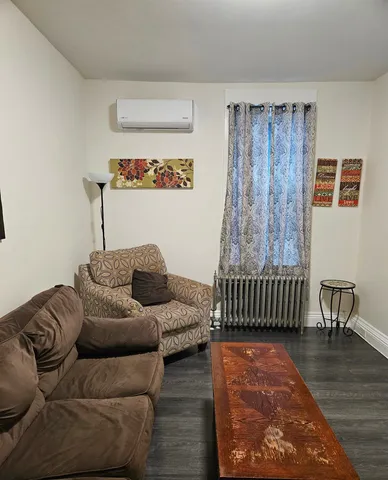 a living room with furniture and a window