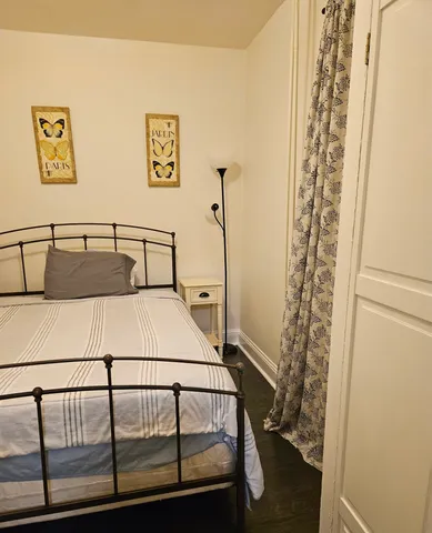 a bedroom with a bed and a table