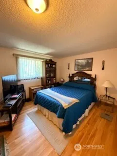 a bedroom with furniture and a window