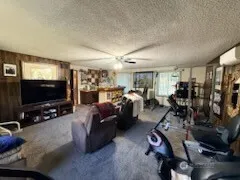 a living room with lots of furniture and a flat screen tv