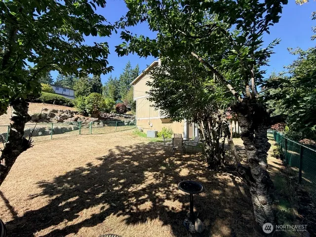 a view of outdoor space with trees all around