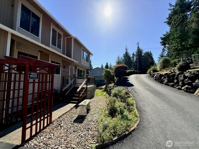 a street view with couple of cars parked on road
