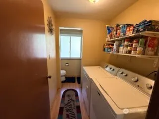 a utility room with dryer and washer