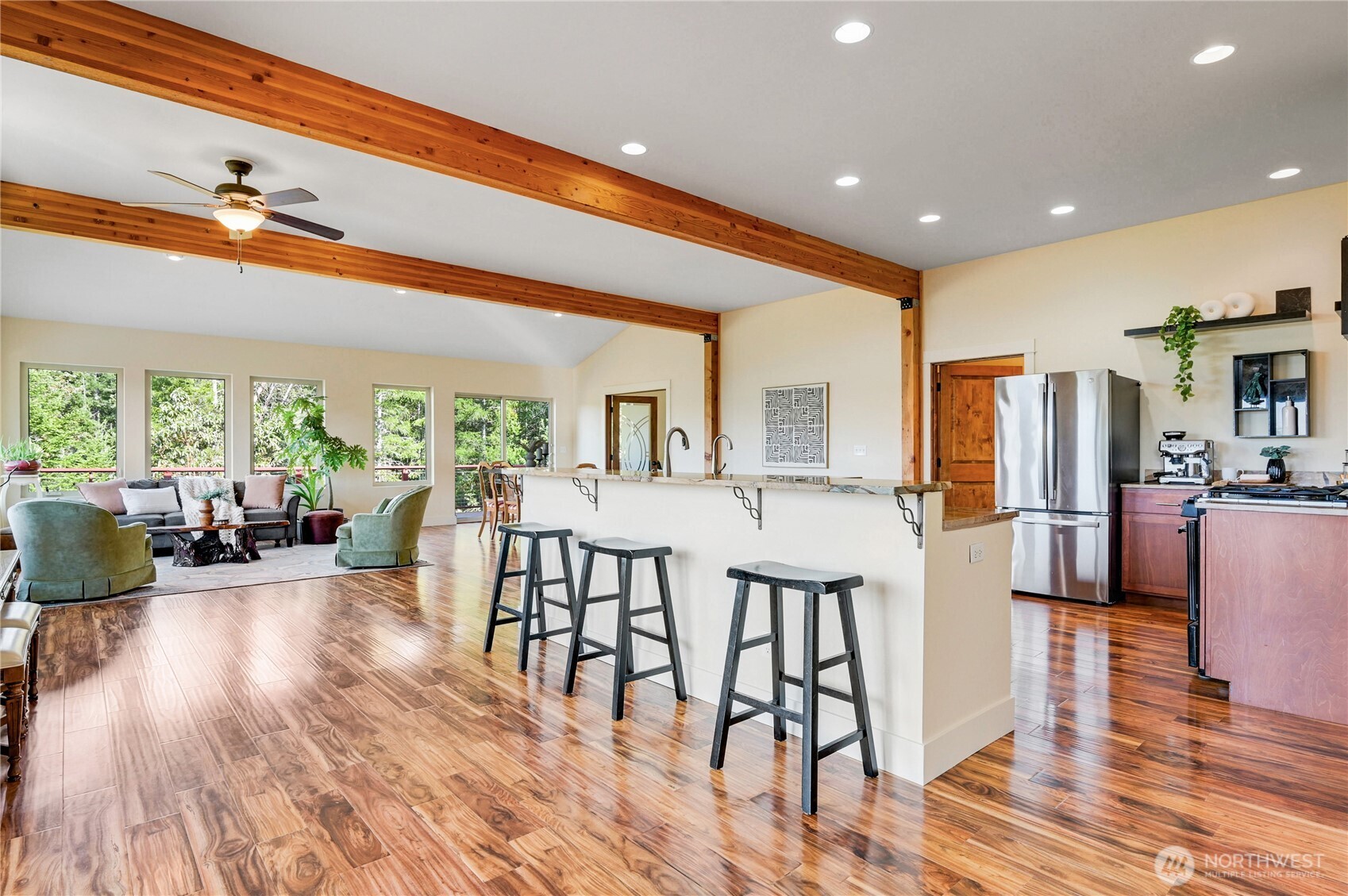 83 Octopus Court Quilcene, WA 98376 - Photo 14 of 40 a very nice looking dining room with kitchen island a large window and stainless steel appliances