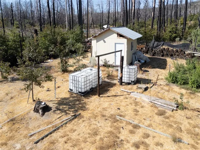 a room with water heater and wooden walls