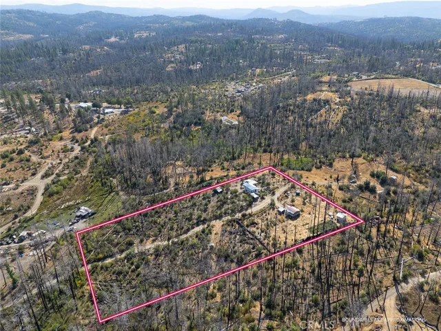 an aerial view of residential house and green space