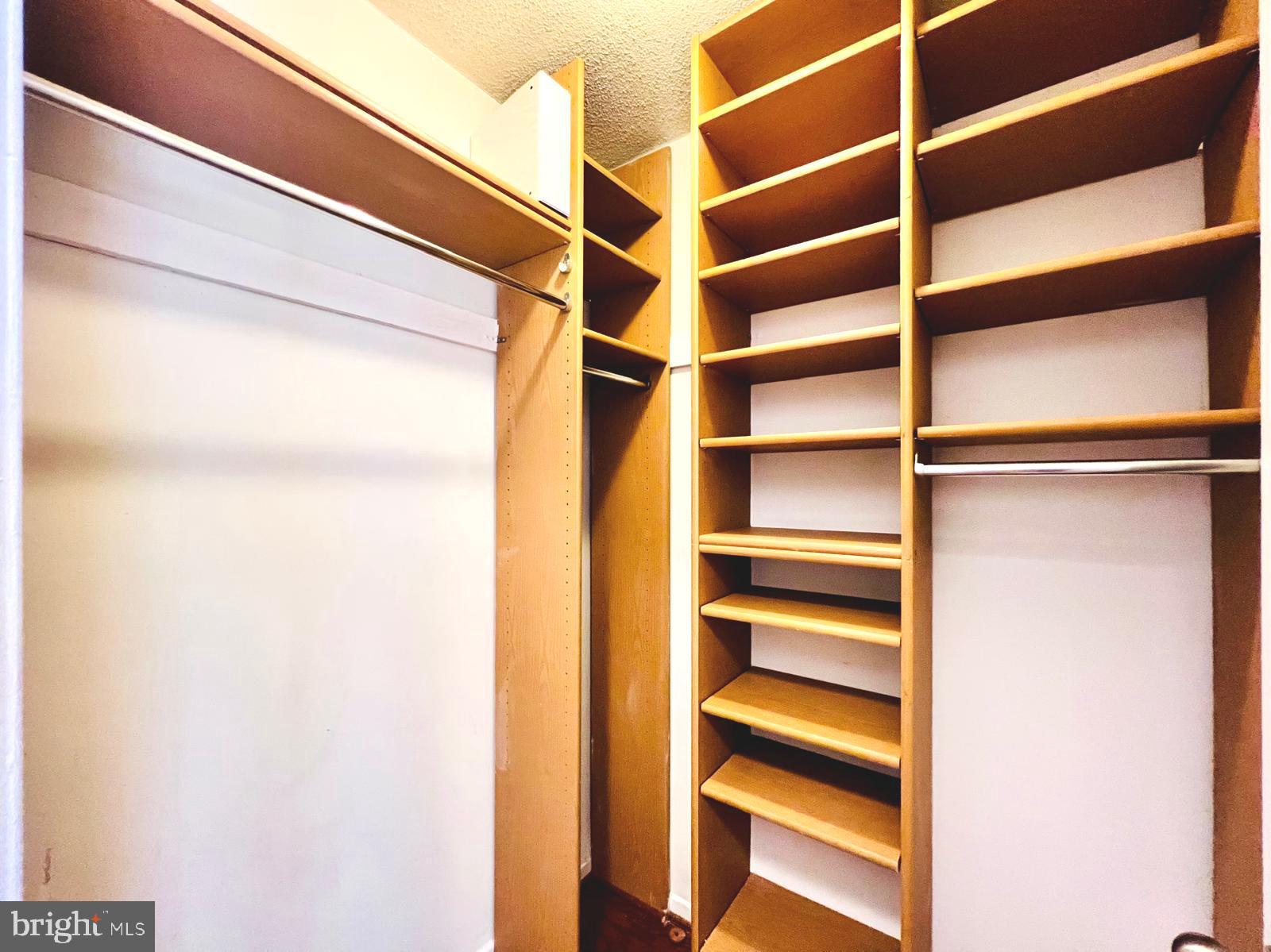 2111 Wisconsin Avenue Northwest, Unit 110 Washington, DC 20007 - Photo 13 of 32 a view of walk in closet with empty racks