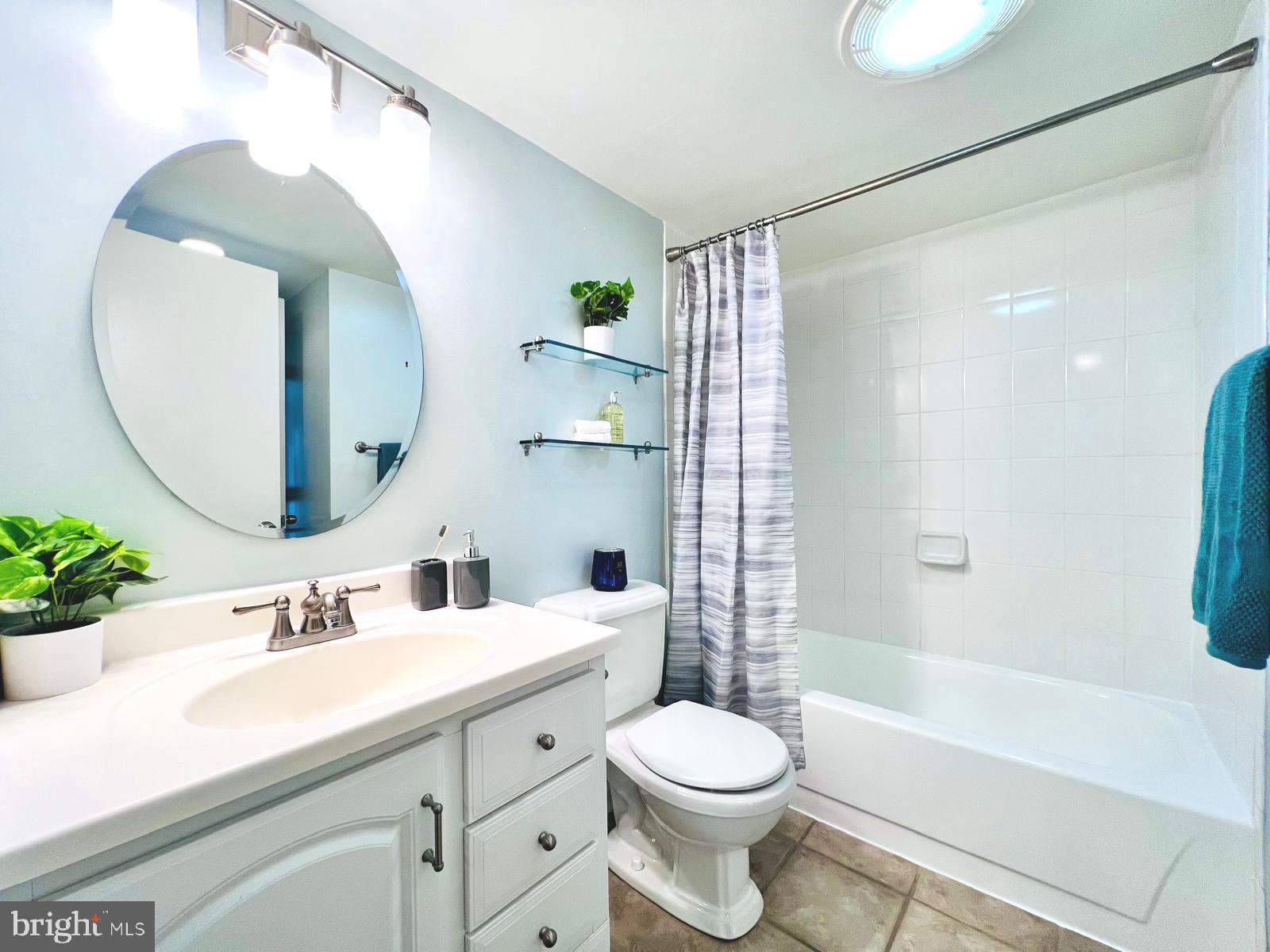 2111 Wisconsin Avenue Northwest, Unit 110 Washington, DC 20007 - Photo 14 of 32 a bathroom with a sink a toilet and shower