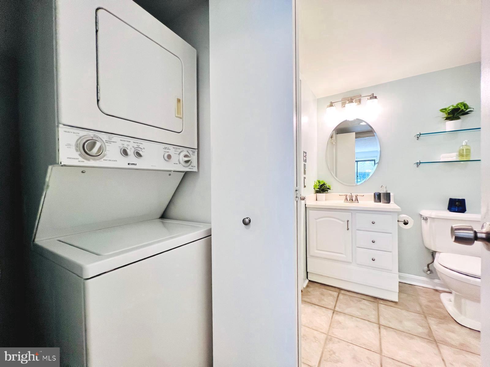 2111 Wisconsin Avenue Northwest, Unit 110 Washington, DC 20007 - Photo 16 of 32 a view of vanity a sink and a mirror