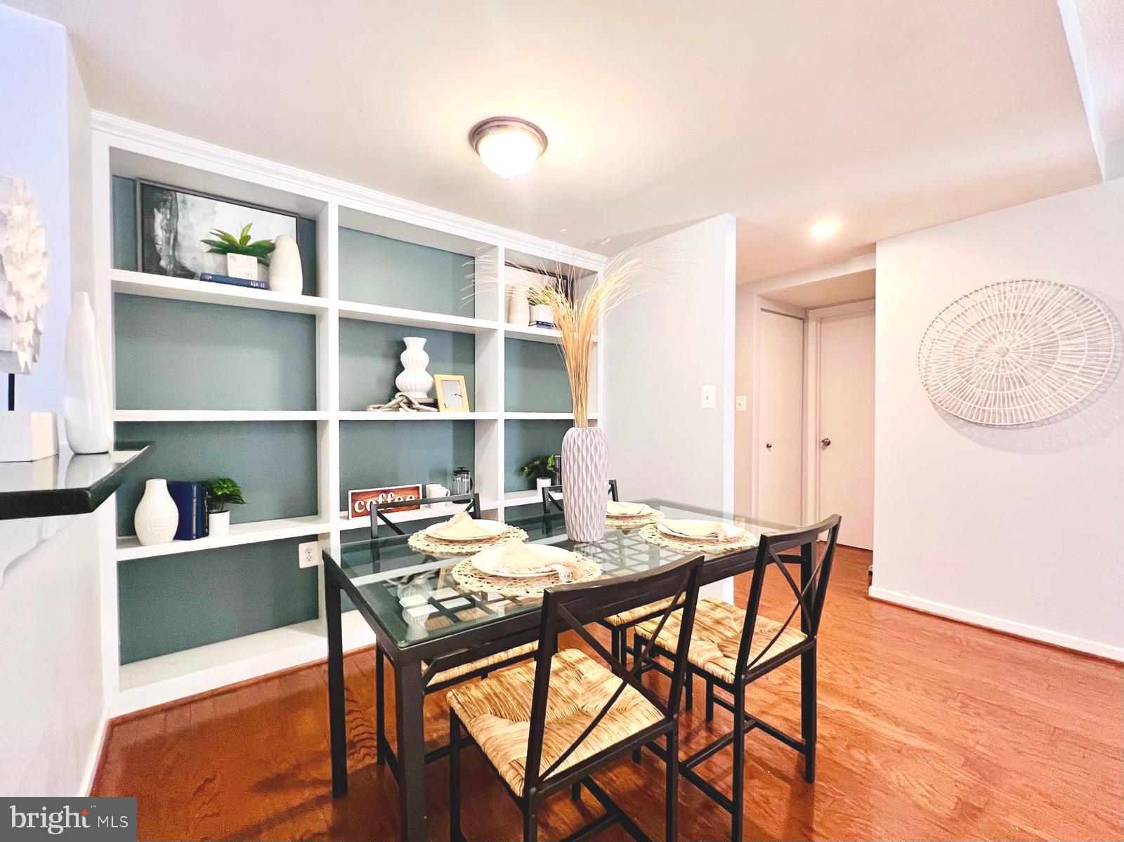 2111 Wisconsin Avenue Northwest, Unit 110 Washington, DC 20007 - Photo 4 of 32 a view of a dining room with furniture