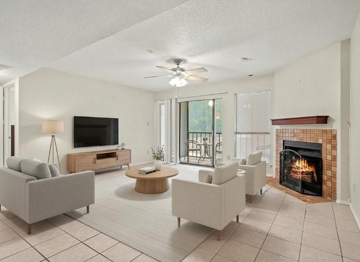 11460 Audelia Road, Unit 172 Dallas, TX 75243 - Photo 1 of 38 a living room with furniture and a fireplace