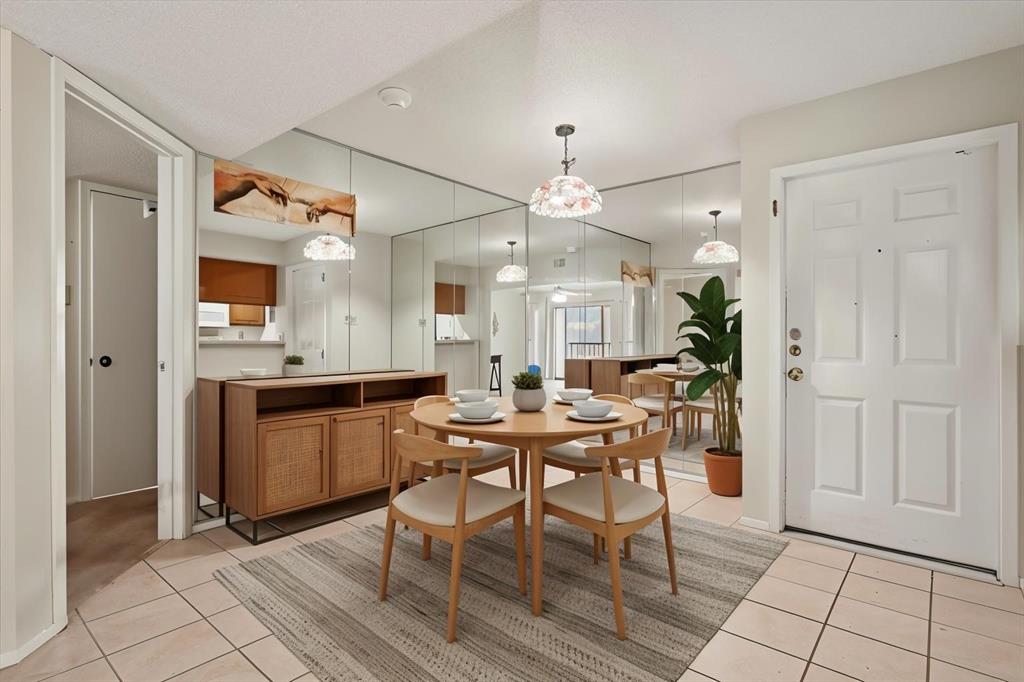 11460 Audelia Road, Unit 172 Dallas, TX 75243 - Photo 15 of 38 a view of a dining room with furniture and chandelier