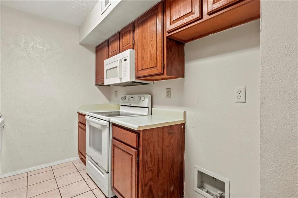 11460 Audelia Road, Unit 172 Dallas, TX 75243 - Photo 23 of 38 a utility room with dryer and washer