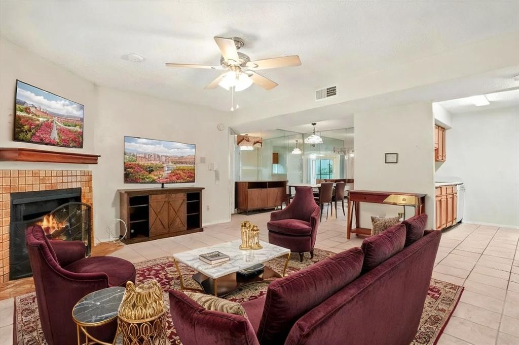 11460 Audelia Road, Unit 172 Dallas, TX 75243 - Photo 7 of 38 a living room with furniture and a fireplace