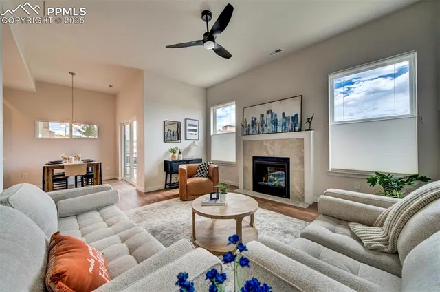 a living room with furniture and a fireplace