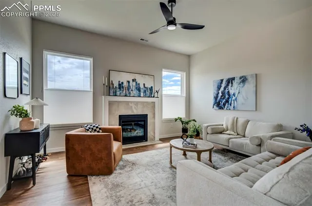 a living room with furniture and a fireplace