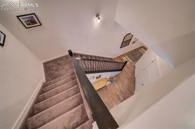 a view of staircase with white walls