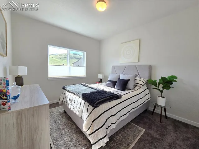 a bed room with a bed and a window