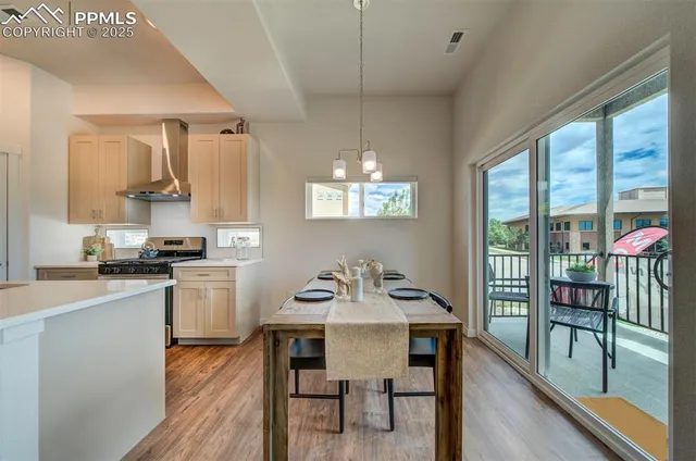 a view of a dining room with furniture window and outside view