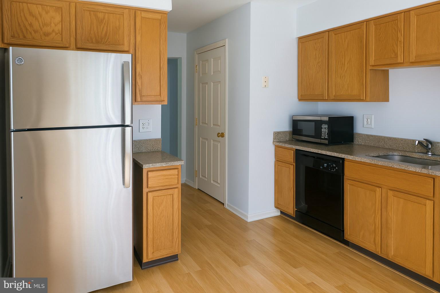 4705 Grenwich Lane Mount Laurel, NJ 08054 - Photo 3 of 12 a kitchen with a refrigerator and a stove