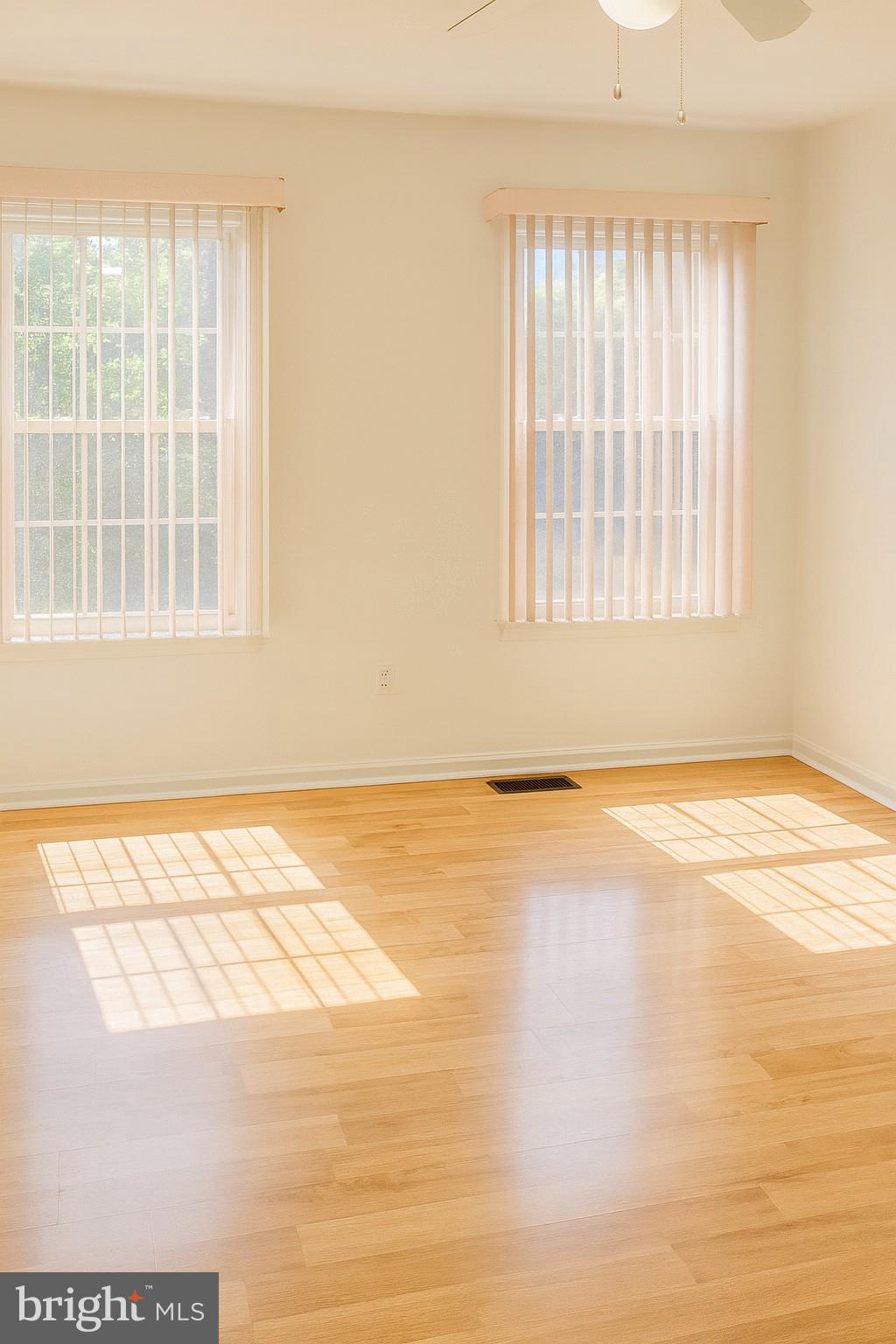 4705 Grenwich Lane Mount Laurel, NJ 08054 - Photo 9 of 12 an empty room with wooden floor and windows