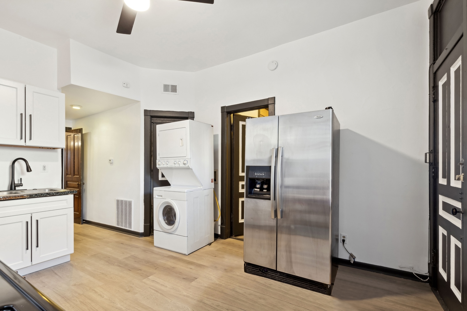 949 North Damen Avenue Chicago, IL 60622 - Photo 11 of 28 a view of a kitchen with a refrigerator and a stove top oven