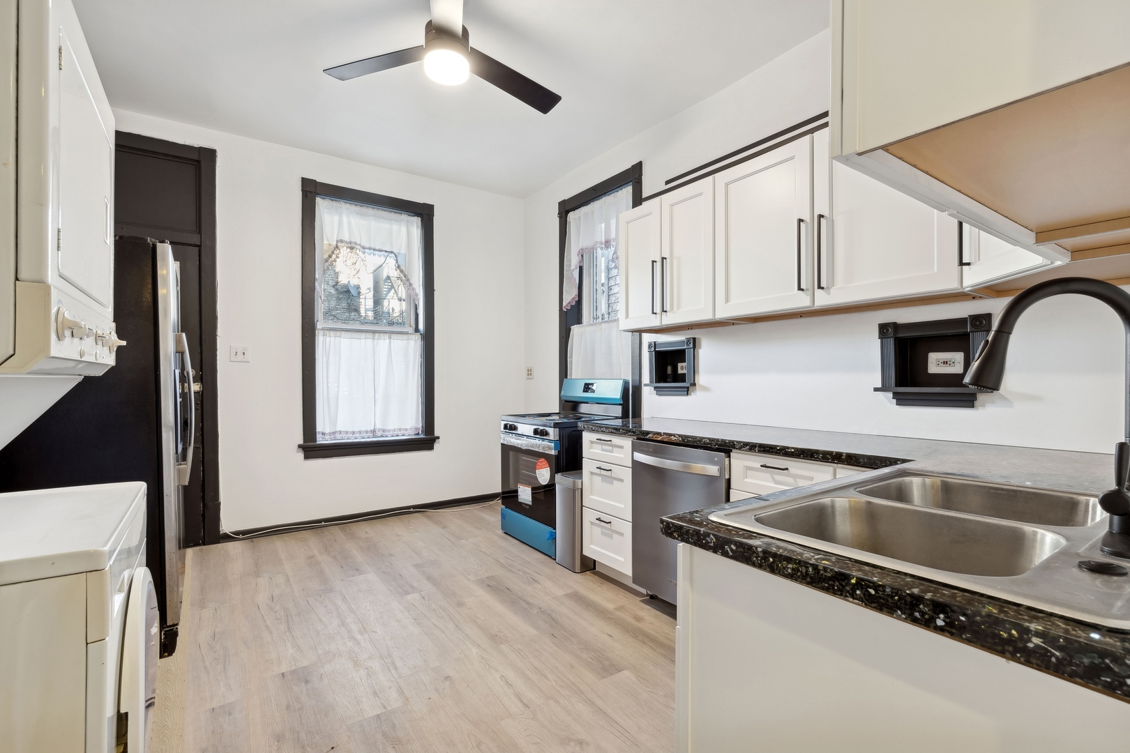 949 North Damen Avenue Chicago, IL 60622 - Photo 12 of 28 a kitchen that has a sink cabinets counter space and appliances